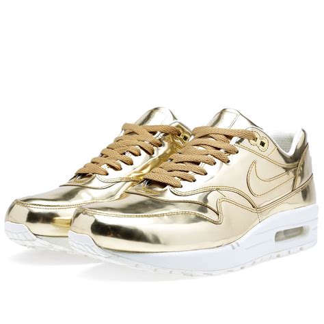 metallic gold nike sneakers.